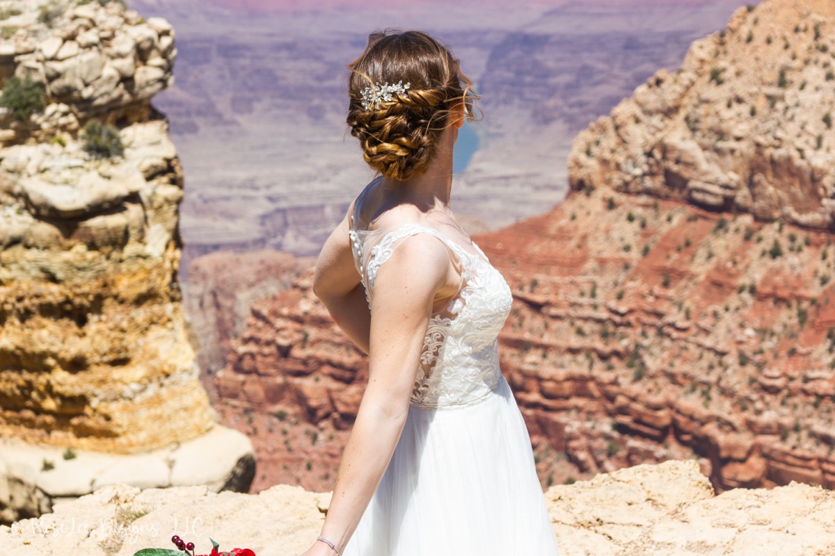 Bride with braided hair overlooking the Grand Canyon