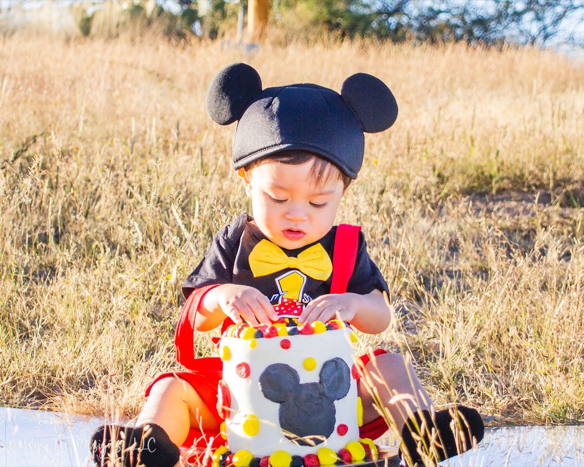 Birthday boy enjoying cake outdoors
